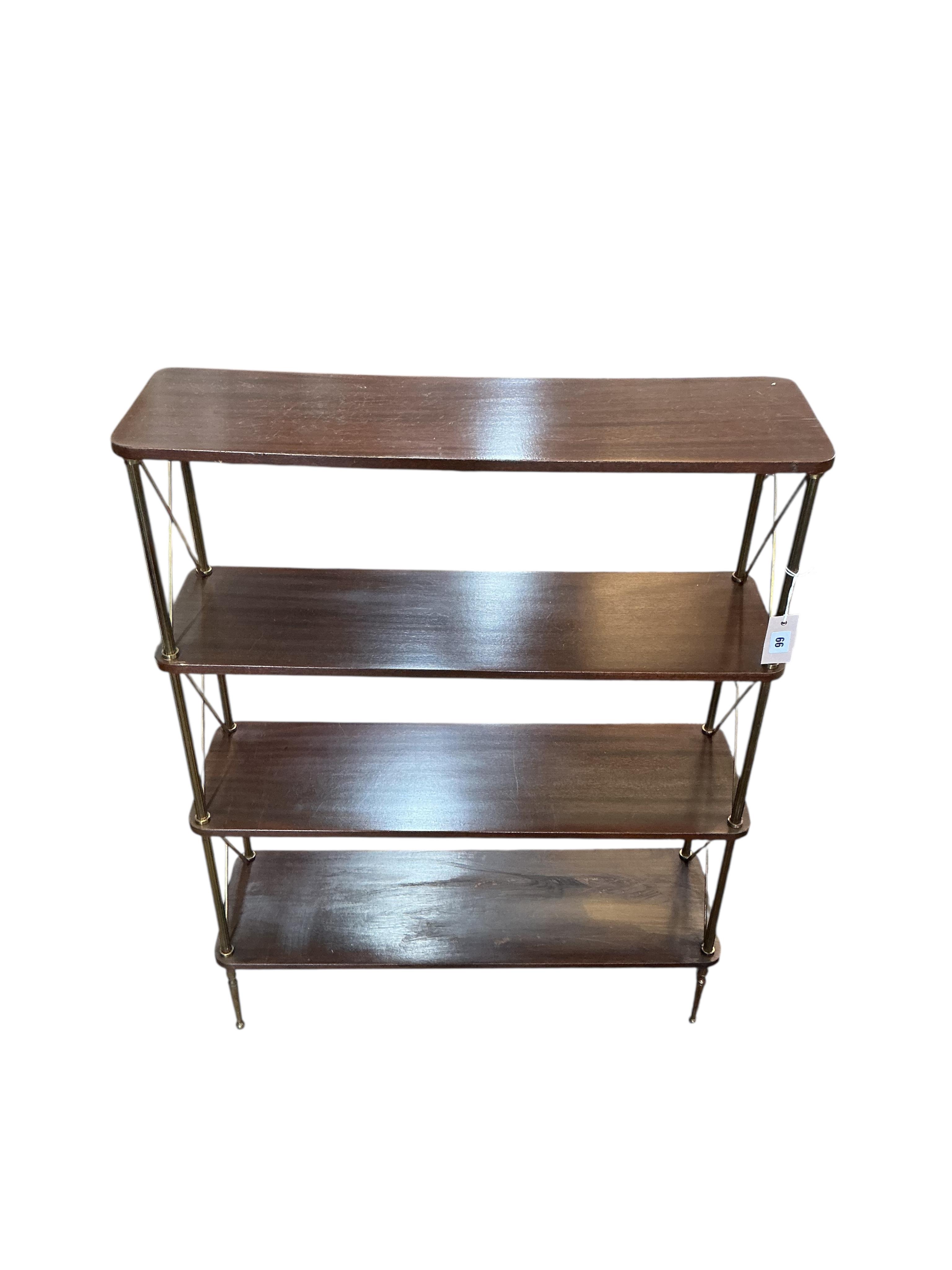 A Maison Jansen style mahogany and brass four tier open bookcase, width 75cm, depth 23cm, height 99cm
